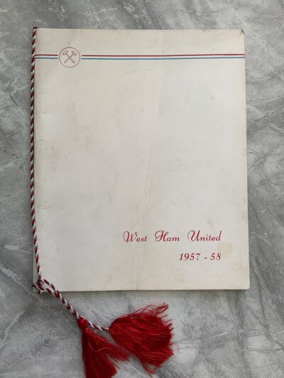 West Ham Football Memorabilia Box: Official club produced menu to celebrate the 2nd division winning season which is good with claret and blue ribbons. Programmes for last match at Upton Park, 2096 FA Cup Final and 3 European aways from 2022 onwards. Books include Youth Soccer Coaching Tony Carr, Geoff Hurst The World Game and The Great Escape.