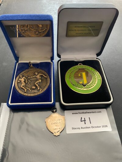 Enfield Football Medals: 1944/45 silver medal with hallmark awarded to HTolley. 1997 Enfield v Tottenham Mickey Dulin (Tottenham) participation medal for his testimonial and a Ryman U21 league champions medal awarded to an Enfield player. (3)