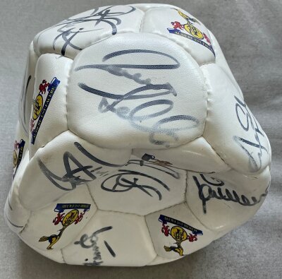 Tottenham Signed Football: Official panelled Spurs ball with 14 signatures to include Ferdinand Redknapp Walker and goalkeeping coach Pat Jennings. Possibly from 2002 - 2003 and not pumped up.