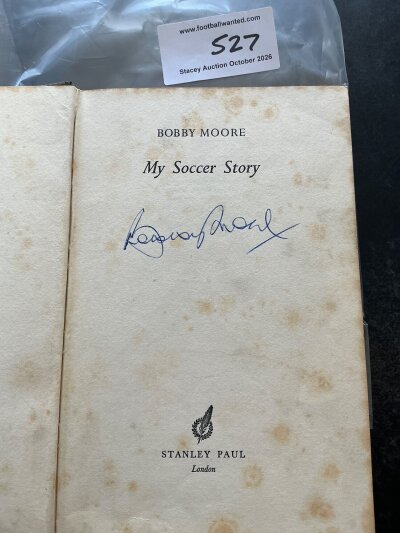 Bobby Moore West Ham + England Signed Football Book: Book named My Soccer Story. In good condition with foxing to pages. Stanley Paul book without dust jacket and two undedicated autographs.
