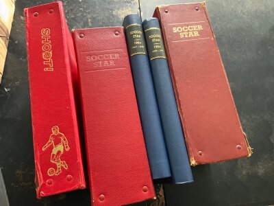 Soccer Star Bound Volumes Of Football Magazines: Two blue bound volumes covering Jan to Aug 1964 plus two red volumes covering Aug 1957 to Nov 1958 and Jan 1962 to Dec 1962. C/ W a bound volume of Shoot magazines from Aug 69 to Feb 70. Good. (5 volumes)