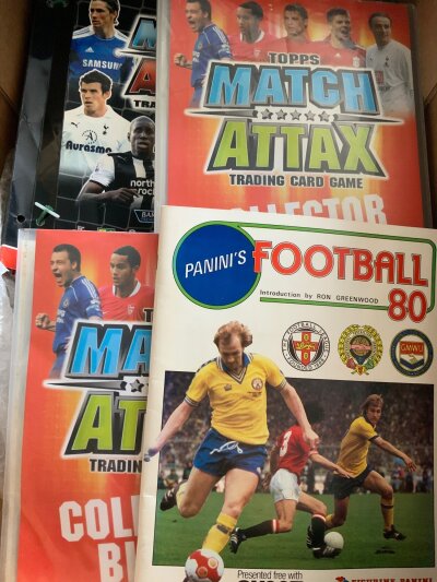 Football Box + Memorabilia Boxes: Books include set of 4 Caxtons from early 60s, Tottenham books Spurs Supreme, Spurs by Julian Holland, Spurs of 1950. Includes 1970s annuals and more. There are Match Attax football card albums Panini 80 with a couple of cards in and some modern programmes. Instructions to sell. (2 boxes)