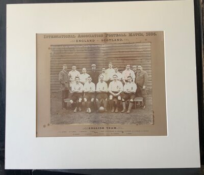 1895 England Original Football Team Group: 130 year old mounted team group on card with players names underneath in print. Taken at Goodison Park Everton on 6 4 1895. Full international team to include  Steve Bloomer of Derby County.