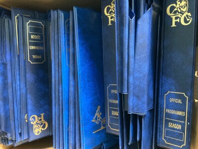Chelsea Home Football Programme Binders: Official newer binders mainly with pocket inside and a few with the wires that go in the centre of programmes. to place Probably used for programmes from 1990s onwards. These would have been purchased from the club shop over the years and are not identical as styles changed. Excellent condition. (est 50)