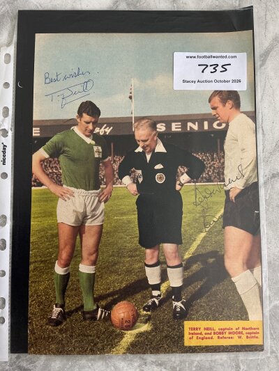 Bobby Moore England Signed Football Picture: Full size colour magazine picture of referee tossing coin for England v Northern Ireland match hand signed by captains Bobby Moore and Terry Neill.