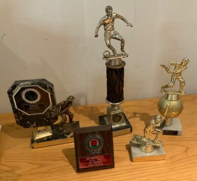 Phil Neville Football + Cricket Awards: Ice Juniors football player of the year 86/87 plus a trophy for getting 3 centuries, 1986 cricket cup winners trophies and more. (5)