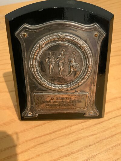 David Gaskell Manchester United Lancs Football League Medal: 56/57 season winners with David as a 16 year old goalkeeper. Plaque has some stains.