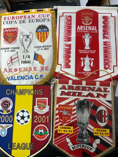 Arsenal Football Pennants: One covering the Champions League group in 2000/2001 involving Sparta Lazio and Shakhtar, 2000/2001 Valencia 94/94 Inter Milan Super Cup and Double Winners 1998. Large pennants are excellent. (4)