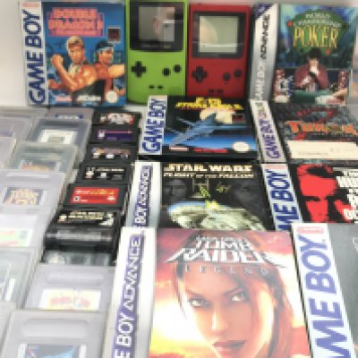 A Nintendo Game Boy Color and a Game Boy Pocket with a Collection of Games.