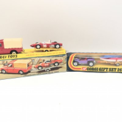 A Boxed Corgi Gift Set #17 Land-Rover With Ferrari Racing Car On Trailer (Trailer is at Fault) and a Boxed Gift Set 26 Beach Buggy And Sailing Boat. No Reserve.