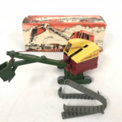 A Boxed Benbros Diecast Medium Excavator.#311. Tracks are perished.