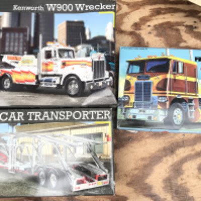 3 Boxed Model Kits. A Revell Kenworth W900 Wrecker. A Car Transporter Trailer And a AMT White Freightliner. No Reserve.