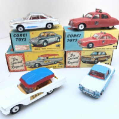 4 X Boxed Corgi Vehicles. A Simca 1000 #315. A 2.4 Jaguar Fire Service Car #213. A Bermuda Taxi #430 and a Triumph Herald Coup&eacute; #231.