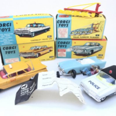 A Boxed Corgi Chevrolet New York Taxi Cab #321. A Chevrolet Police Car #481 (Restored). A Four Furrow Plough #56 and part of a Buick Riviera #245.