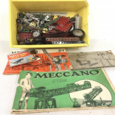 A collection of Meccano pieces and instruction booklets. No reserve