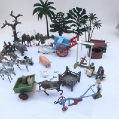A Collection of Vintage Britains Figures including a Plough and Farmer. Child on Swing and Various Animals.