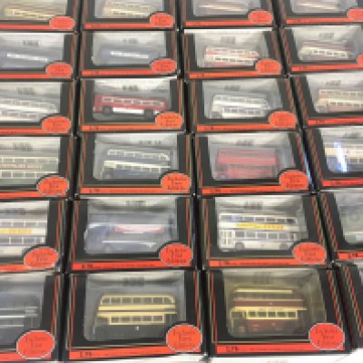 A collection of 24 diecast model buses by Exclusive First Editions in display packaging. No Reserve