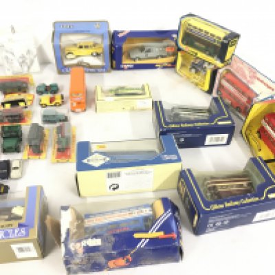 A collection in excess of 25 diecast model vehicles mostly in original packaging . Manufacturers include Corgi..ERTL and others.