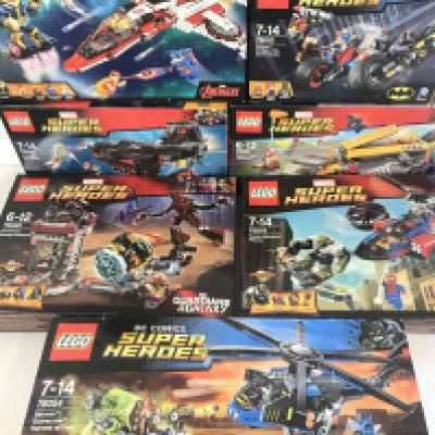 7 Boxed Lego Sets including D.C. And Marvel. Sets have Been Built.
