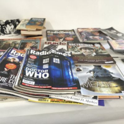 A collection of of Dr.Who books..photos..jigsaw..dvds..and Radio Times magazines with Dr Who articles NO RESERVE