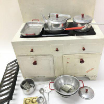 A Vintage Childs Vulcan tin Kitchen Stove With Utensils.