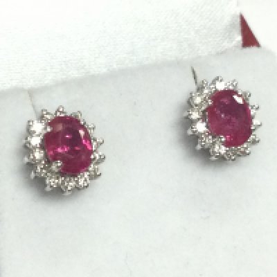 Pair of 18ct white gold oval ruby and RBC diamond cluster studs, boxed. Rubies 1.00ct approx. Diamonds 0.30ct approx . 2.8g total weight 
