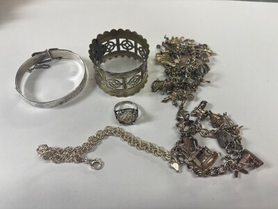 Two silver charm bracelets, silver bracelet , bangle , Wembley 1924 EPNS napkin ring etc