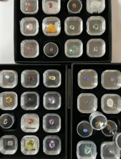 3 cases of loose gemstones, some with certificates. Including Tanzanites.