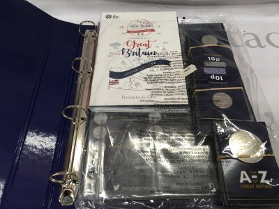 A change checker album with Great Britain Coin Hunt A to Z Royal Mint set with coins
