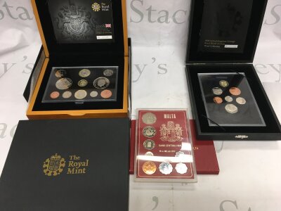 Two royal mint 2008 coin sets and a 1972 Malta set.
