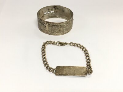 A silver ID bracelet and a silver bangle. Total weight 52.28g
