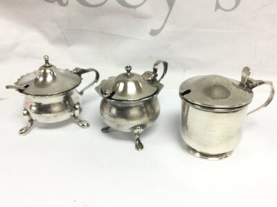 Two silver hallmarked mustard pots, one EPNS