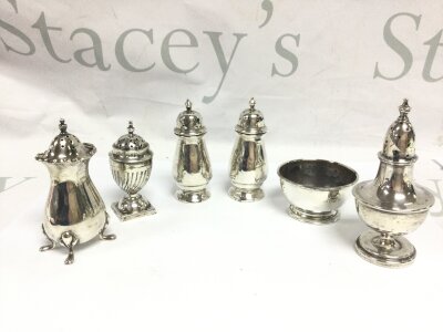Five silver hallmarked condiments and a condiments bowl
