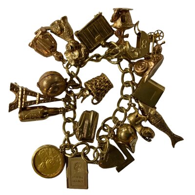 A heavy 9ct gold charm bracelet. Overall weight 80.6g