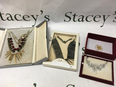 Deco style Necklaces including a black diamonte necklace  ,white diamonte necklace, red and black necklace , gold tone necklace