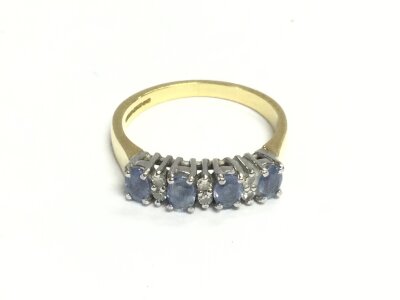An 18ct gold sapphire and diamond rings. Size O and 4.20g