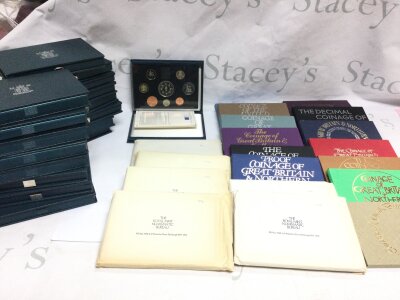 36 coinage sets from various years.