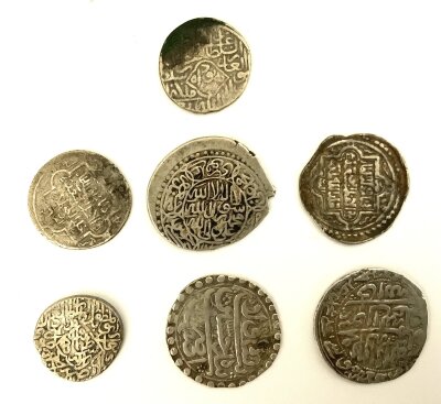 A small collection of early Rupees. (A)
