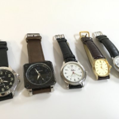 Five vintage quartz watches, seen working.