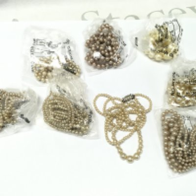 A Collection of simulated pearl necklaces . NO RESERVE