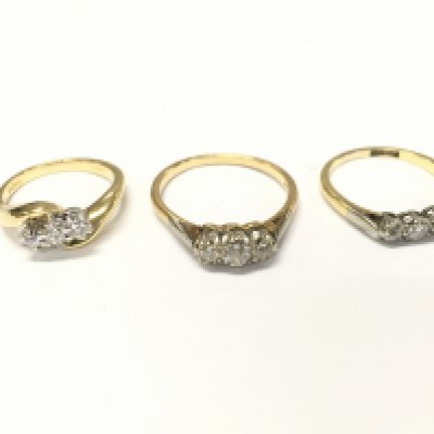 Three 18ct gold diamond three stone rings. J N and Q and approximately 9.8g
