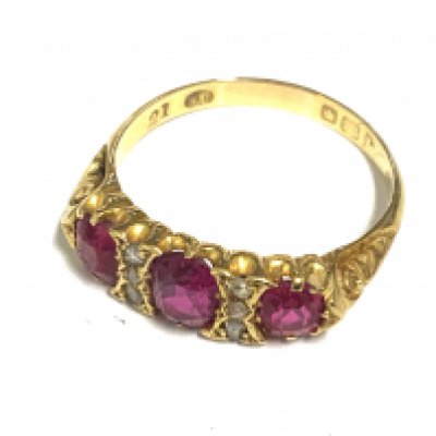 A good quality red stone and diamond ring, size P.5