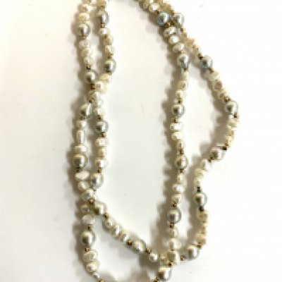 A multicoloured pearl necklace interspersed with gold beads.