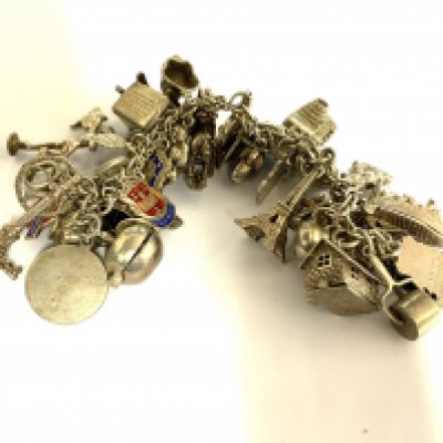 A heavy sterling silver charm bracelet. 