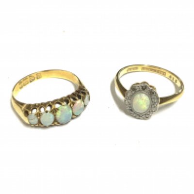 An 18ct yellow gold ring set with 5 graduated opals together with an opal ring surrounded by small chip diamonds. 