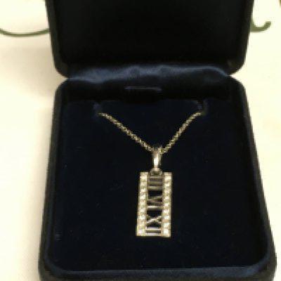 A boxed 18ct white gold Tiffany necklace.