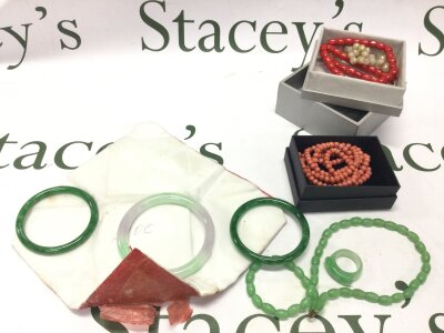 Jade and coral jewellery including necklaces, bangles and a ring