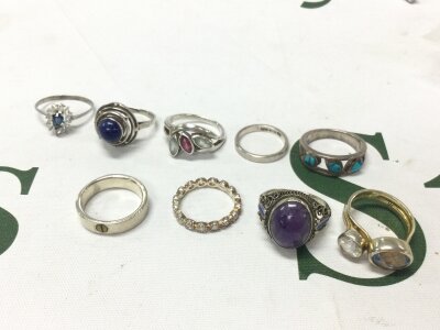 A small collection of silver rings set with various gem stones, mostly around Ring size M. 31g total weight approximately