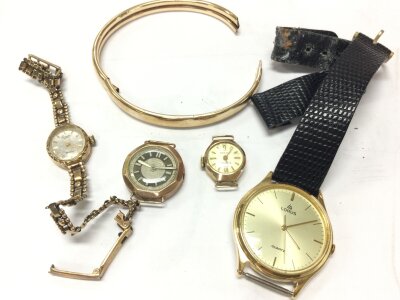 A collection of vintage gold including 3 ladies watches, a non-gold cased Lorus gents watch , a 9ct gold bangle. 32g total gold weight approximately
