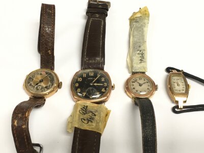 Four gold cased watches.